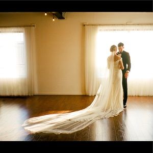 Dramatic cathedral-length, ivory raw-edge tulle veil. Perfect condition!